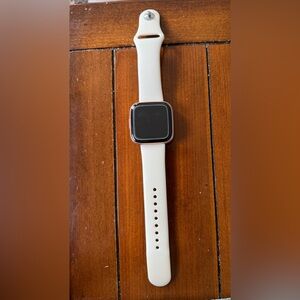 Rose Gold Smartwatch with Pale Pink Band. Fitbit Versa 2